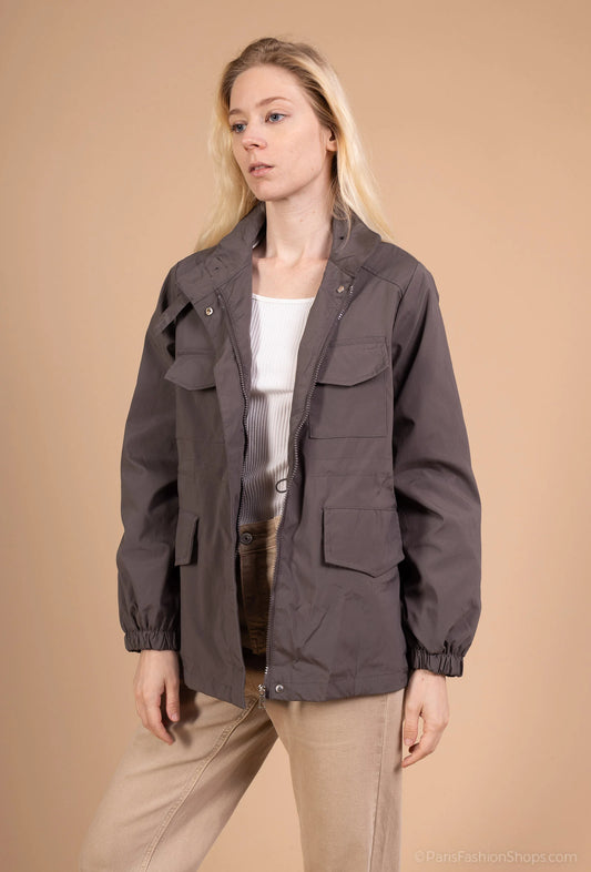Utility jacket with four pockets, high collar, and zip closure