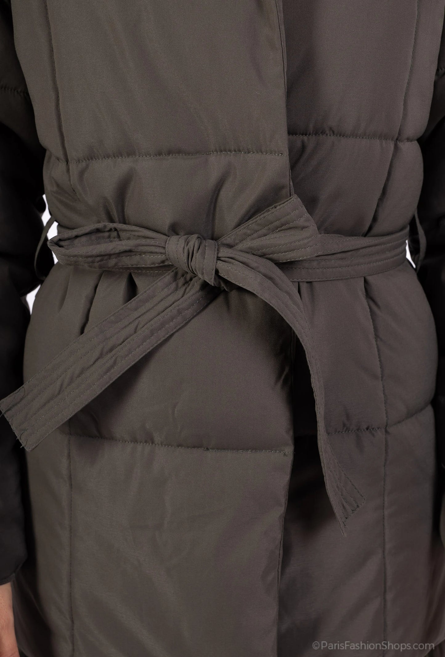 Long padded coat with belt, high collar, and elegant fit