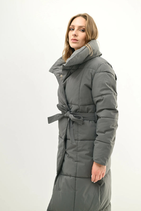 Long padded coat with belt, high collar, and elegant fit
