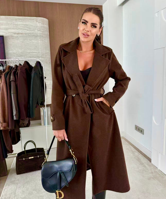 Coat with lining and textured material belt