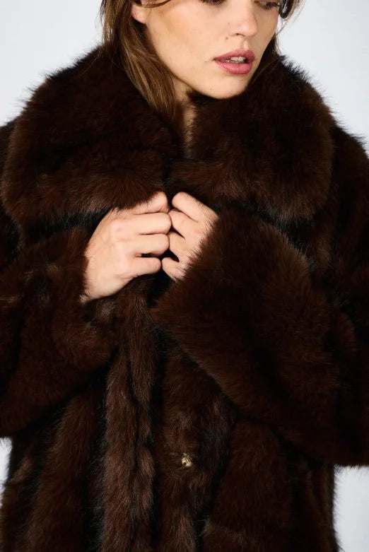 Chic faux fur coat with oversized collar, elegant cocoon style