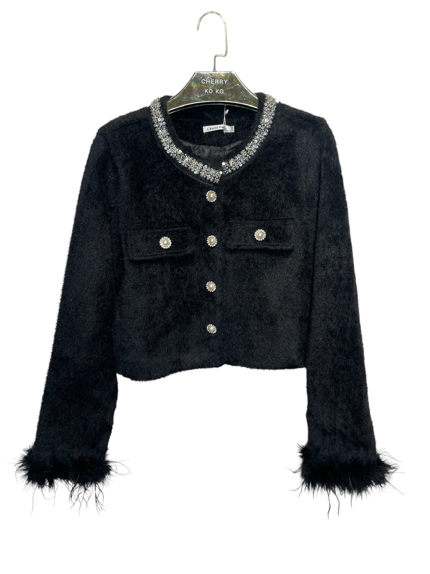 Short jacket with jeweled collar and feather-trimmed sleeves – chic and glamorous