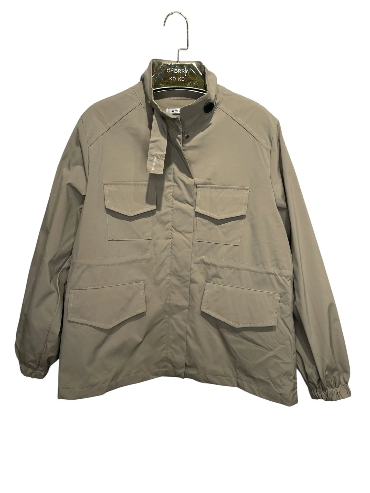Utility jacket with four pockets, high collar, and zip closure