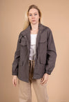 Utility jacket with four pockets, high collar, and zip closure