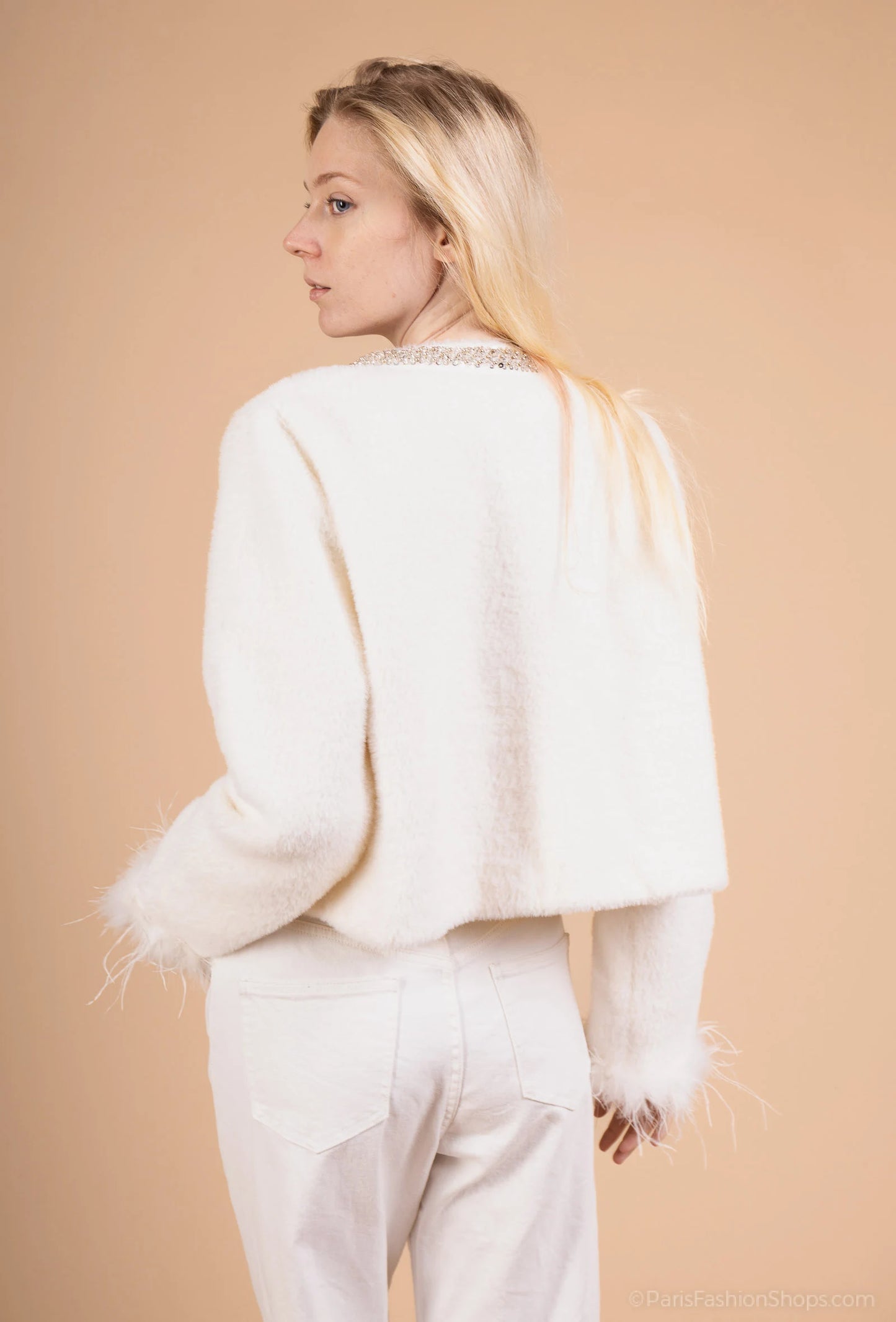 Short jacket with jeweled collar and feather-trimmed sleeves – chic and glamorous