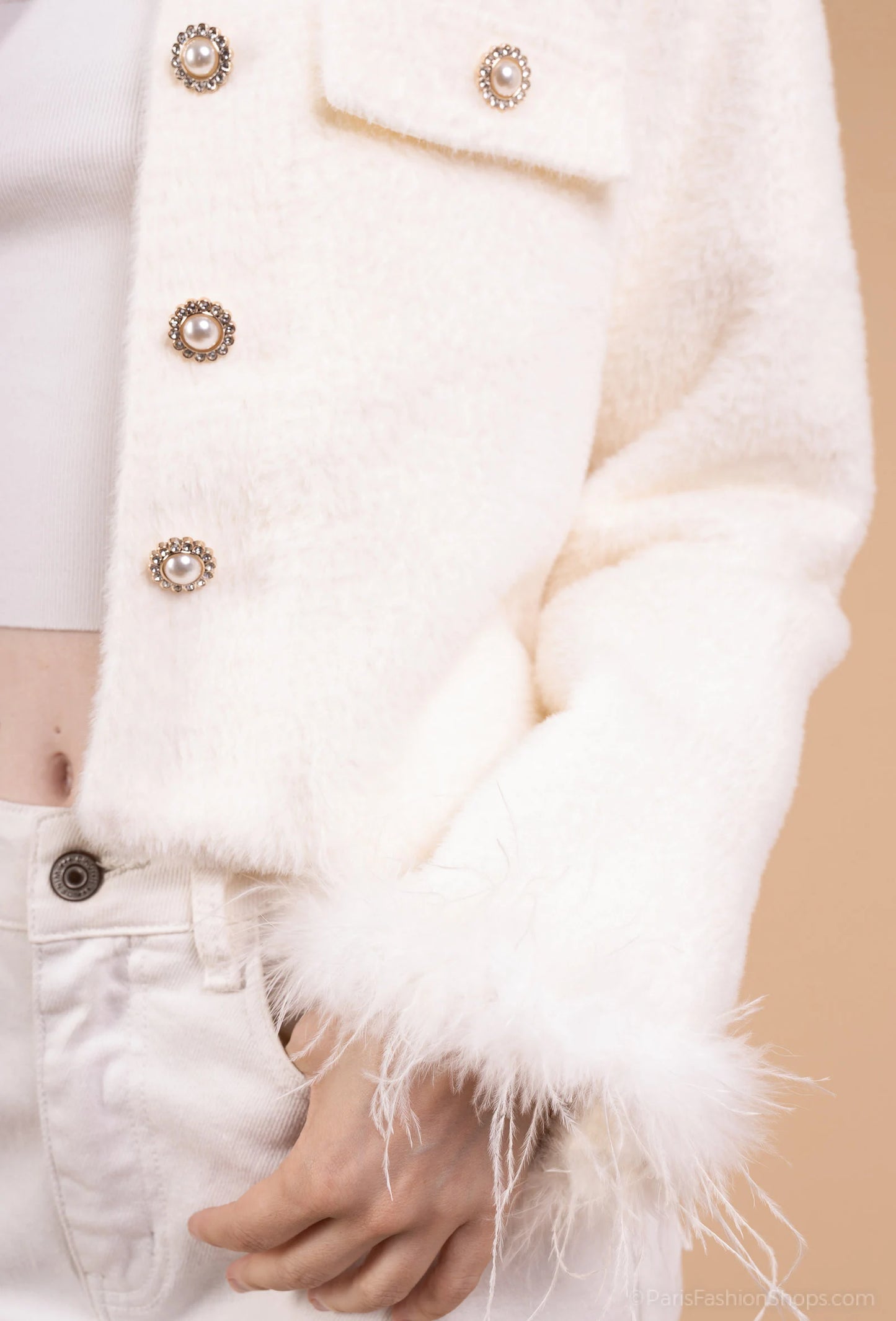 Short jacket with jeweled collar and feather-trimmed sleeves – chic and glamorous