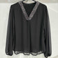 V-neck blouse with shiny sequins