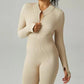 Ribbed zip-up jumpsuit with long sleeves and high collar