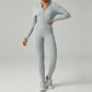 Ribbed zip-up jumpsuit with long sleeves and high collar