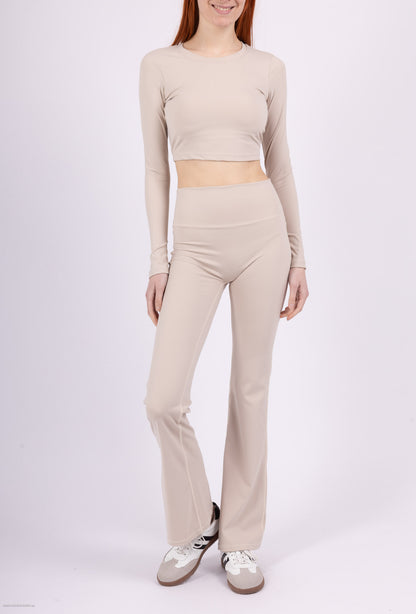 Long sleeve lace-up back top and flared pants set, sporty chic style