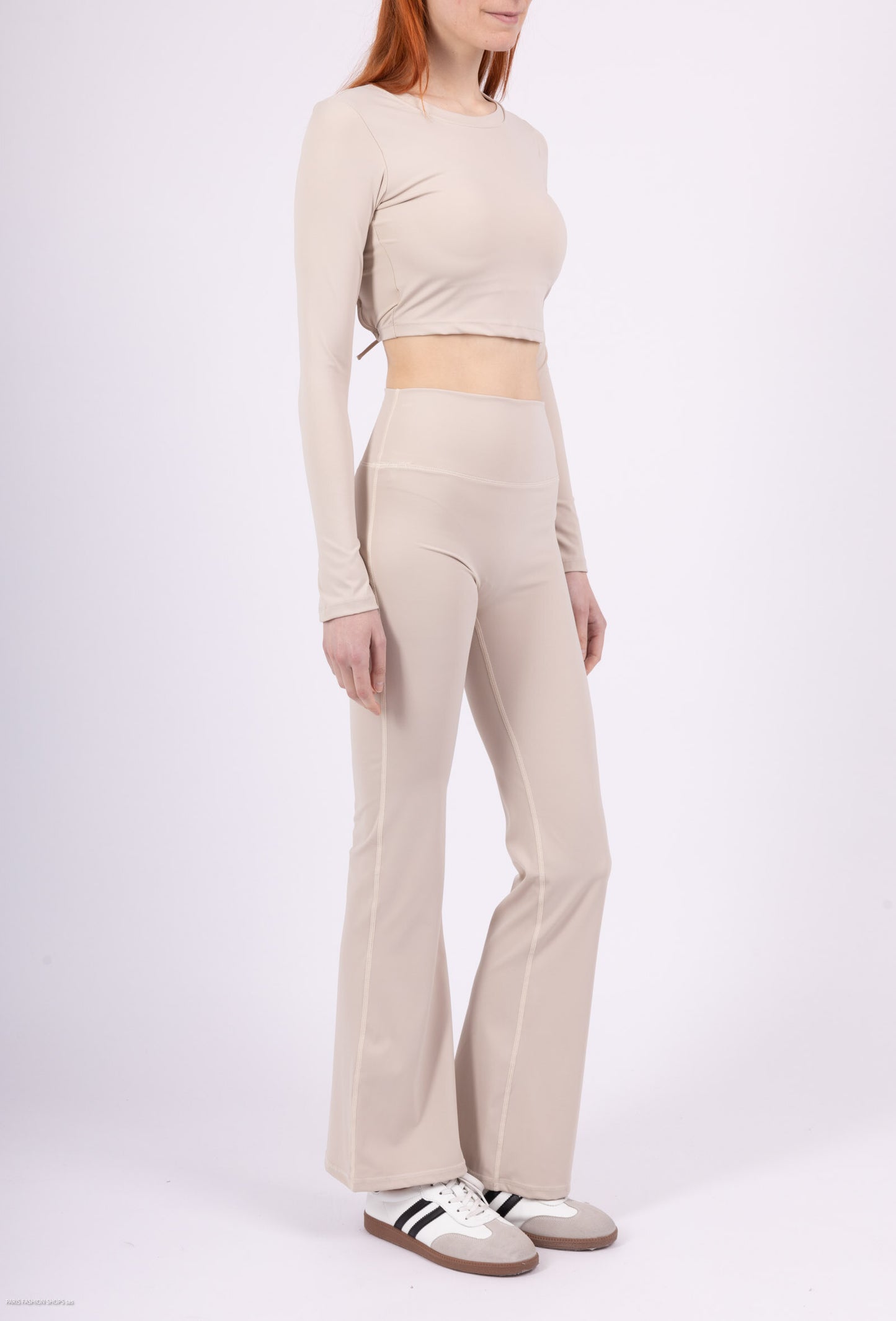Long sleeve lace-up back top and flared pants set, sporty chic style