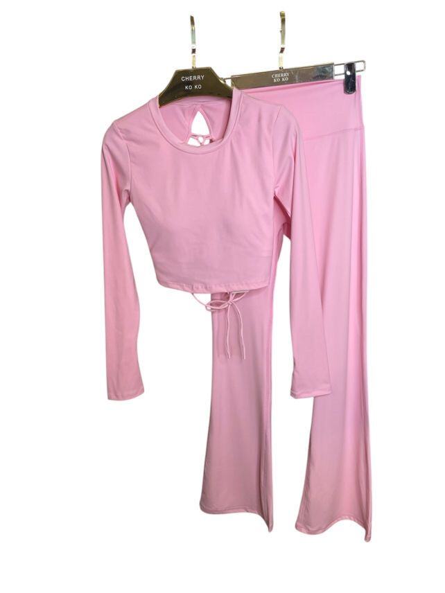 Long sleeve lace-up back top and flared pants set, sporty chic style