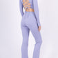 Long sleeve lace-up back top and flared pants set, sporty chic style