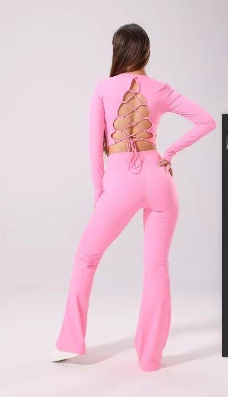 Long sleeve lace-up back top and flared pants set, sporty chic style