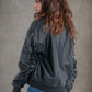 Women's oversized faux leather bomber jacket with straight cut, long sleeves, zip details, urban casual chic look