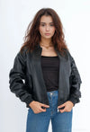 Women's oversized faux leather bomber jacket with straight cut, long sleeves, zip details, urban casual chic look