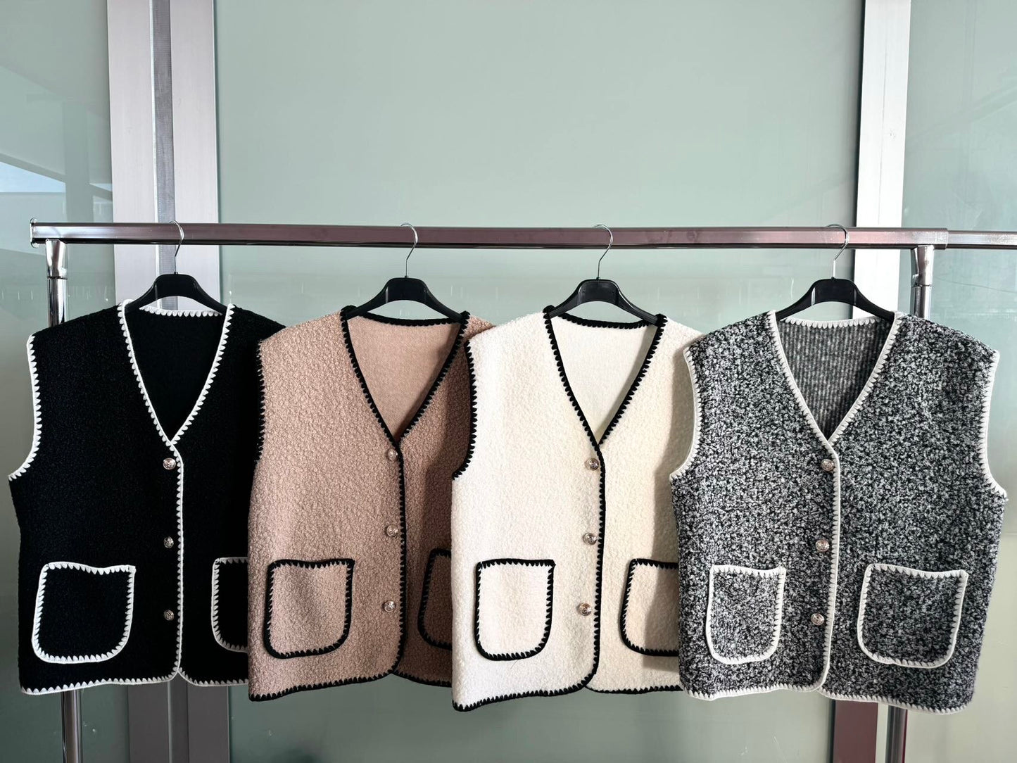 Boucle effect sleeveless vest with pockets and gold buttons