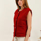 Gold -eyed sleeveless vest with golden button