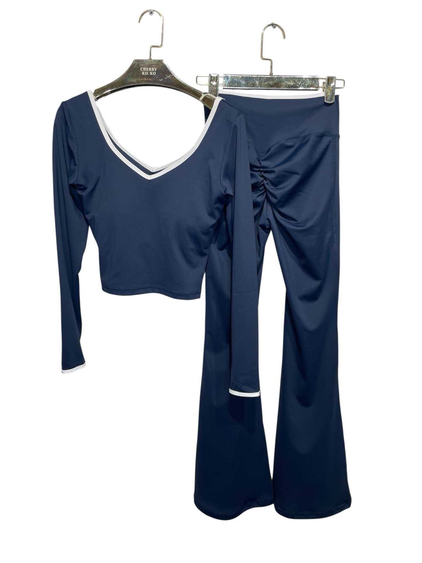 LYANA – Crossed top and flared pants set with contrasting details