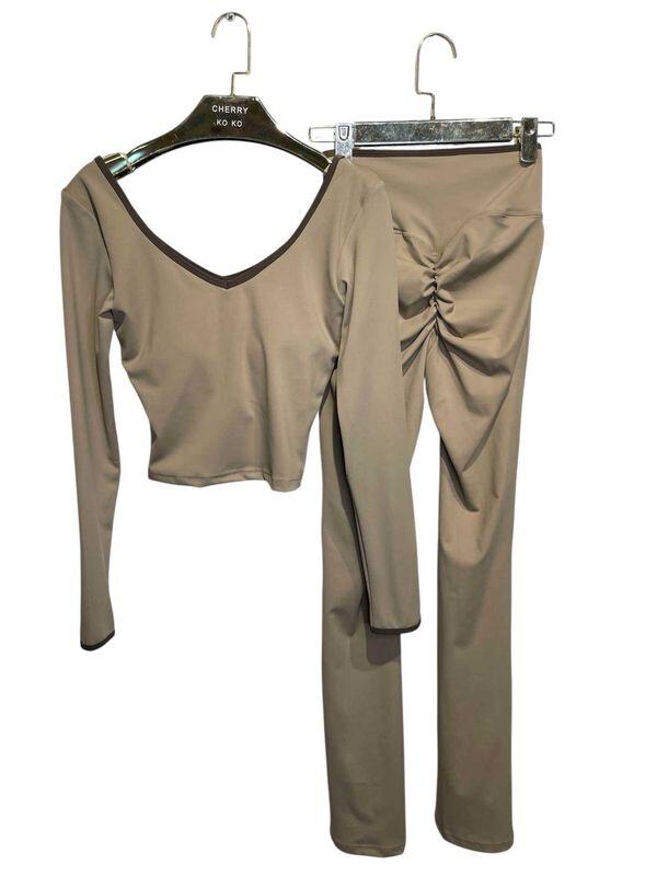 LYANA – Crossed top and flared pants set with contrasting details