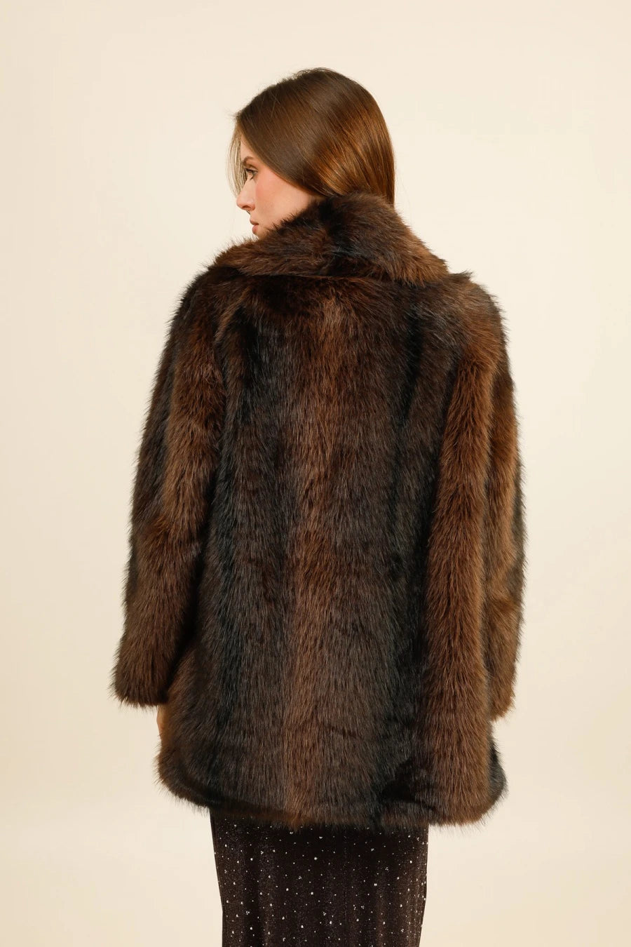 Mid-length faux fur coat with a wide collar, featuring an elegant and trendy cut