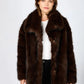 Chic faux fur coat with oversized collar, elegant cocoon style