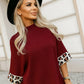 High-neck sweater with leopard cuffed sleeves