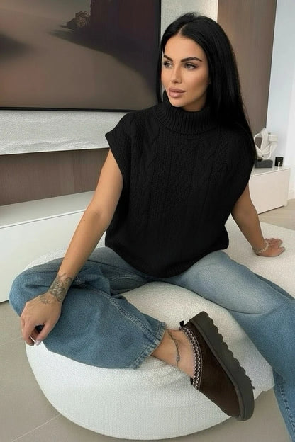 Sleeveless turtleneck sweater with gradient cables