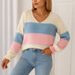 V-neck sweater with multicolored stripes and long sleeves