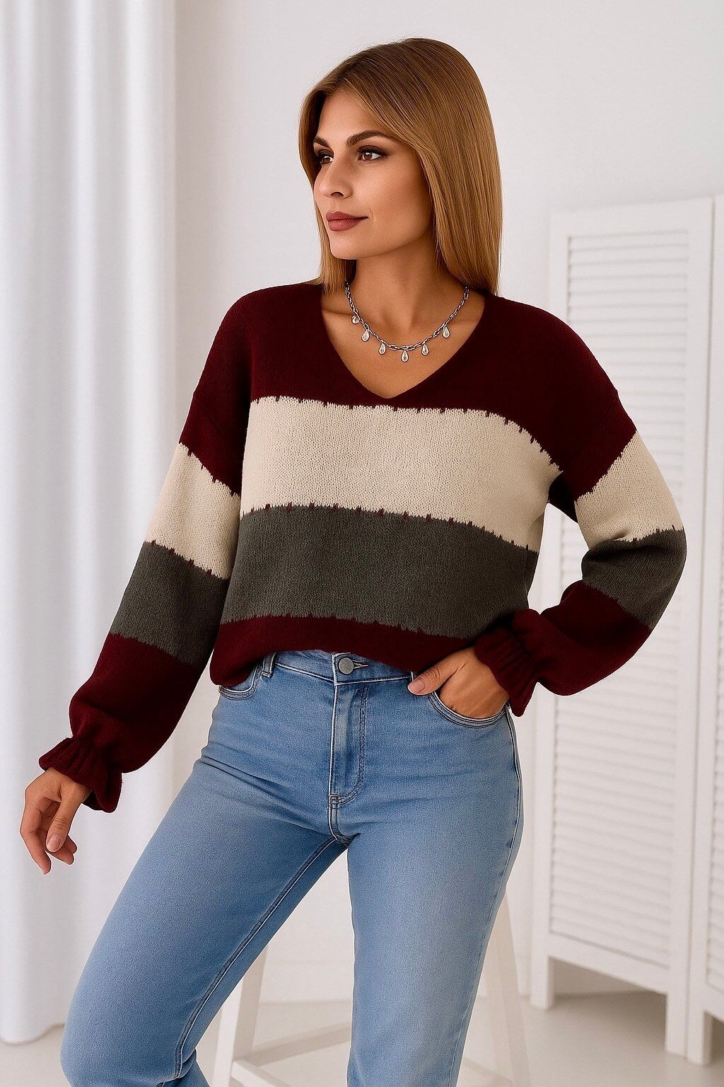 V-neck sweater with multicolored stripes and long sleeves