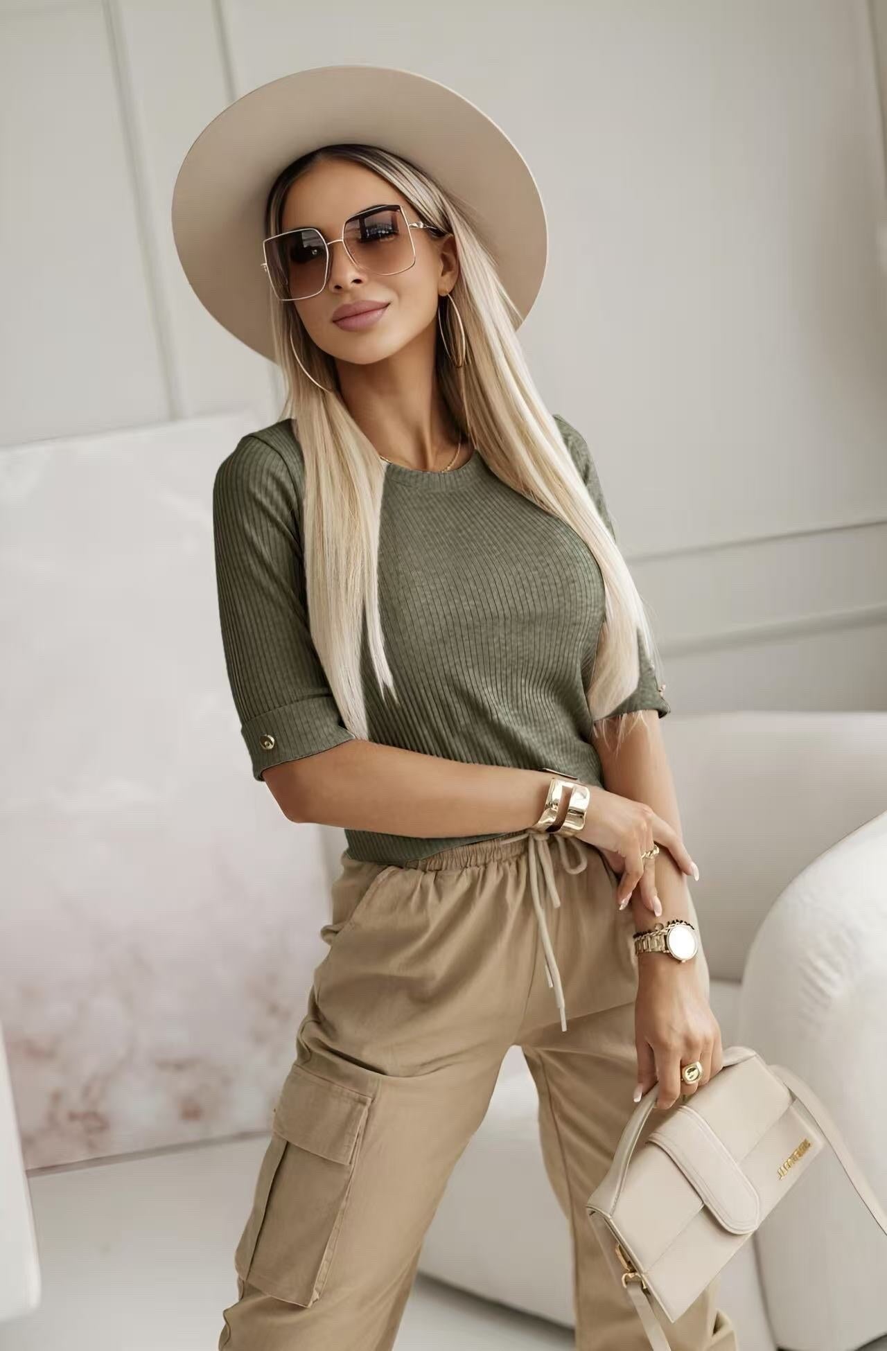 Sweater shiny material. Gold button