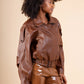 RAVEN – Belted grained leather-look jacket