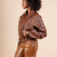RAVEN – Belted grained leather-look jacket