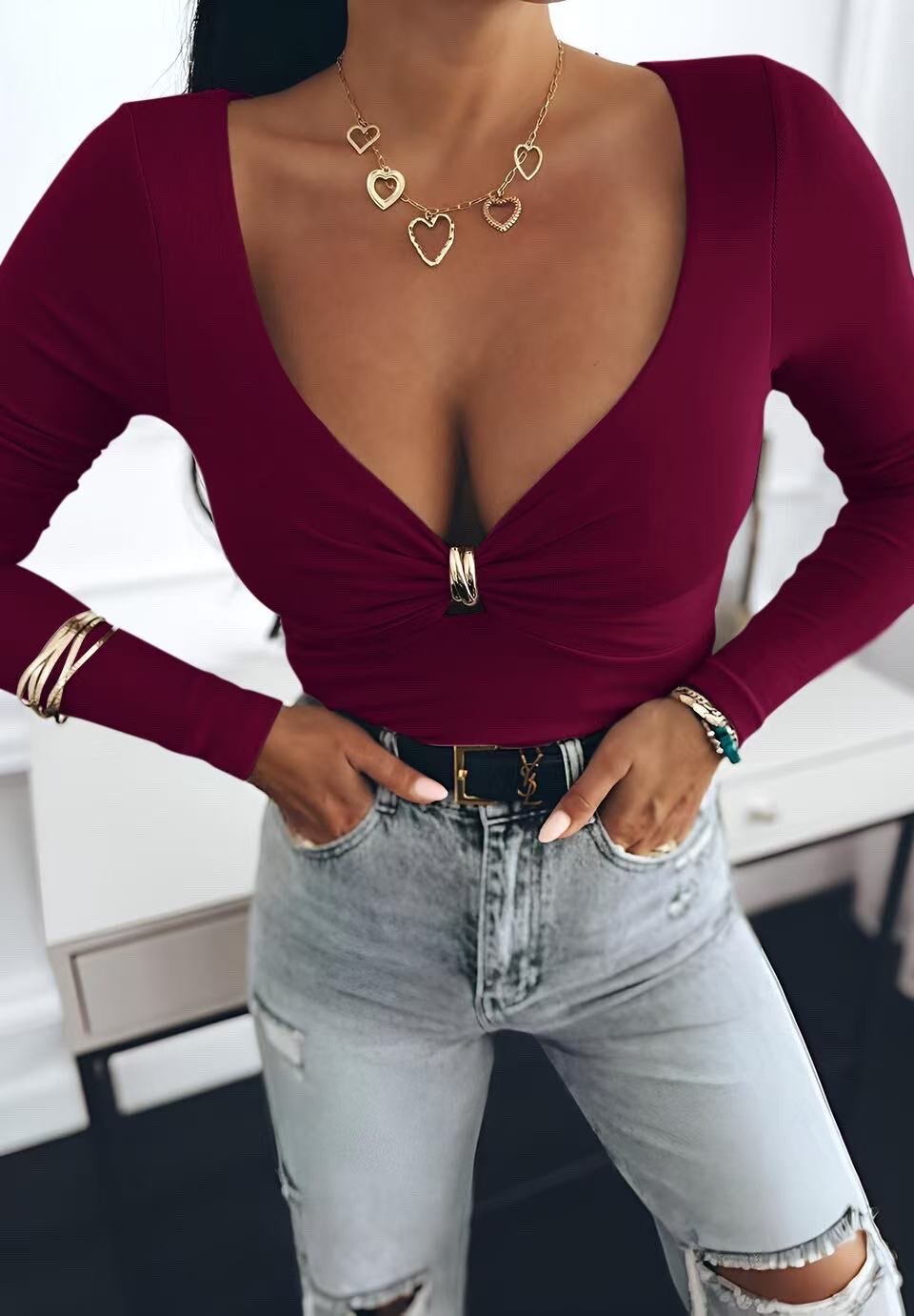 Top with neckline with long sleeve ring