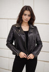 Short faux leather jacket with quilted stitching and zip details