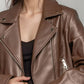 Smooth faux leather jacket, cropped cut, notched collar, and silver zips for a bold look.