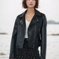 Smooth faux leather jacket, cropped cut, notched collar, and silver zips for a bold look.