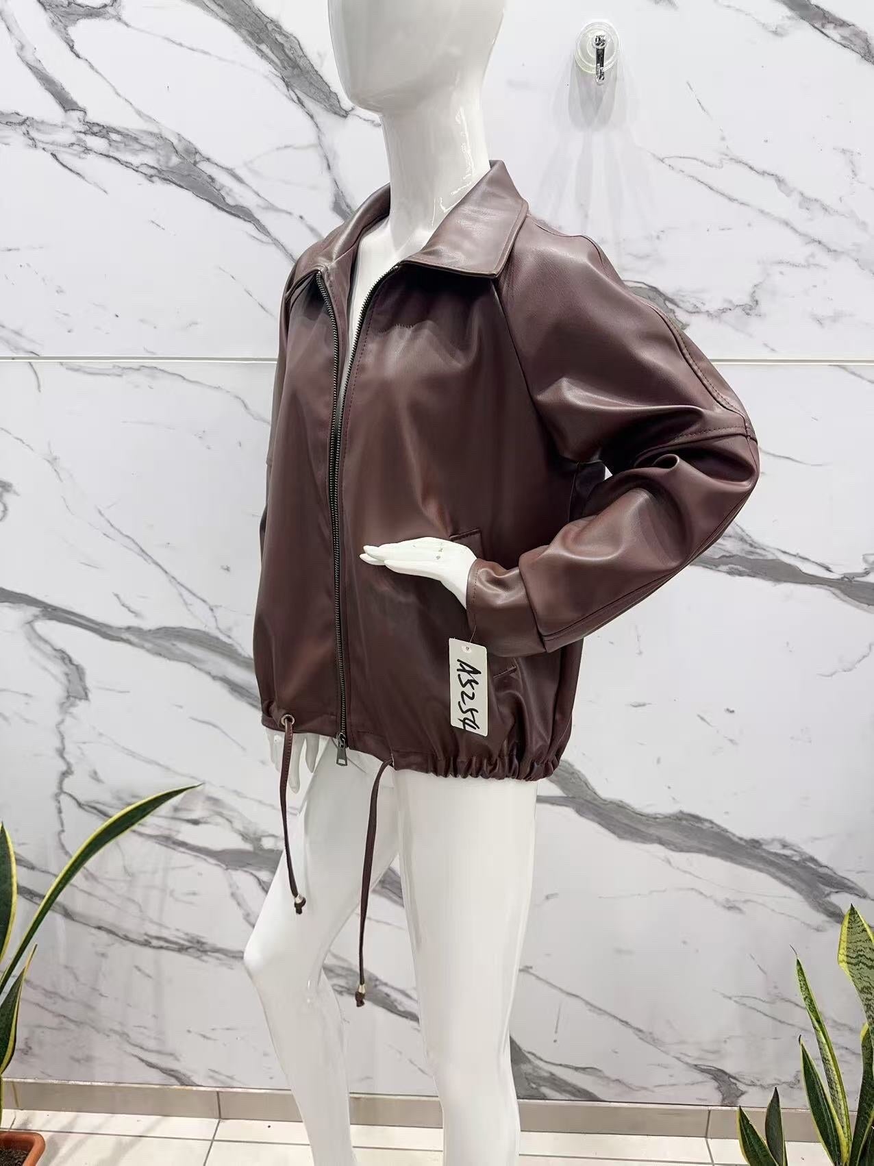 Oversized faux leather jacket with adjustable drawstrings