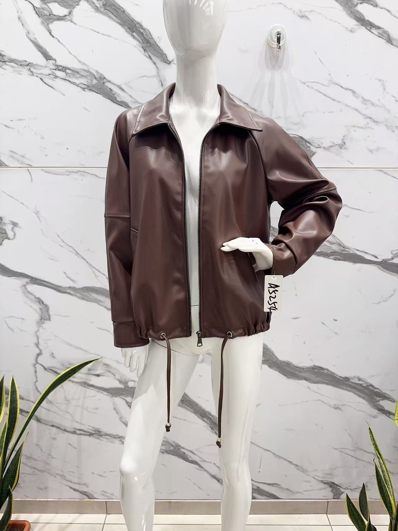 Oversized faux leather jacket with adjustable drawstrings