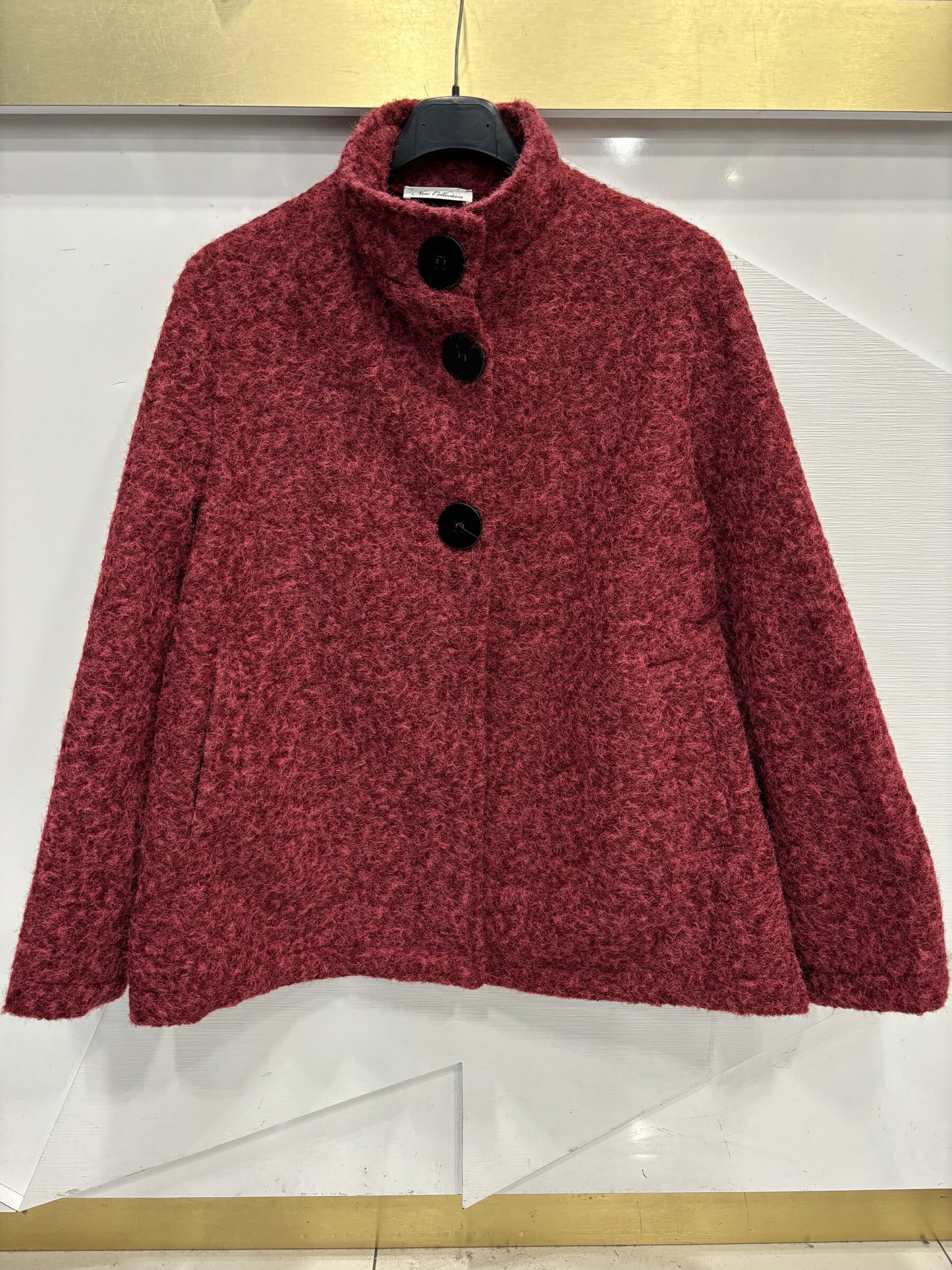 Poncho style wool jacket loop with large black pimples