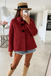 Poncho style wool jacket loop with large black pimples
