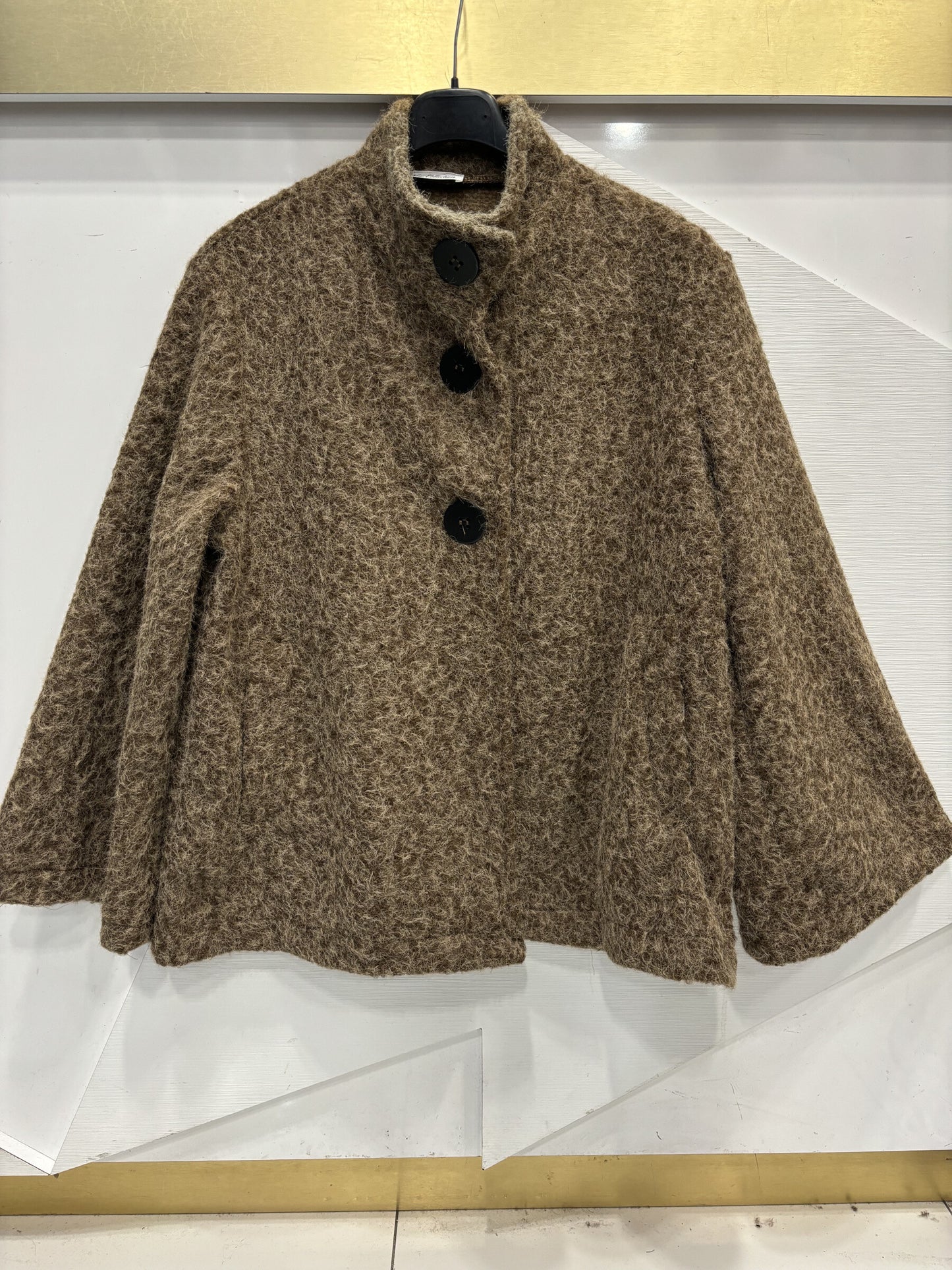 Poncho style wool jacket loop with large black pimples