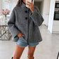 Poncho style wool jacket loop with large black pimples